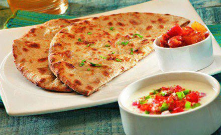Punjab Pratha House Infocity - Buy 1 get 1 free offer on menu for just Rs 9. Go on a paratha trial!